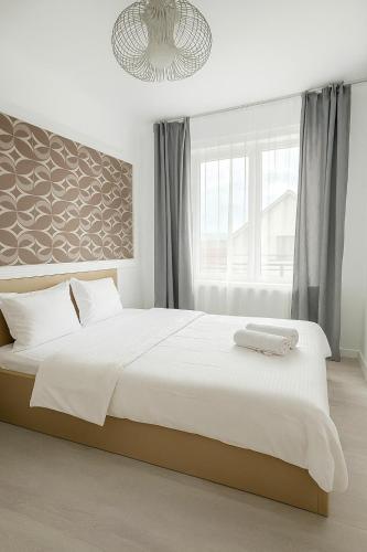 Postel nebo postele na pokoji v ubytování DD Apartments - Iuliu Moldovan