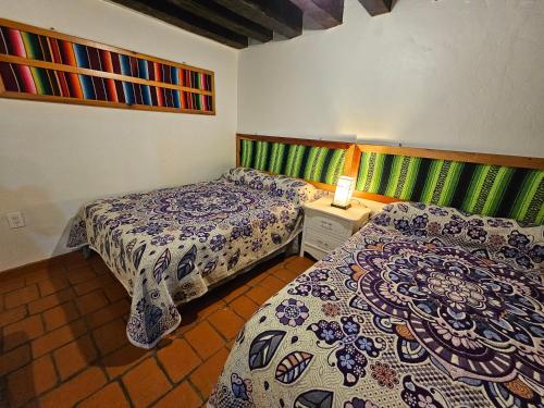 Ένα ή περισσότερα κρεβάτια σε δωμάτιο στο Casa Mexicana con encanto
