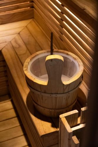 a wooden bath tub in a wooden sauna at AMAN Villas & SPA in Gili Air