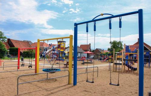 a playground with many different types of playground equipment at One-Bedroom Holiday Home In Sint-Annaland in Sint Annaland
