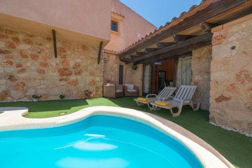 a house with a swimming pool in a yard at Cas Mure in Porreres