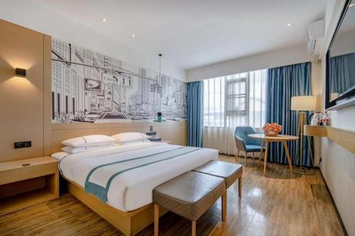 Postel nebo postele na pokoji v ubytování City Comfort Inn Laibin Tongmu