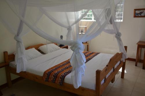 Katil atau katil-katil dalam bilik di Kamunjila Lodge