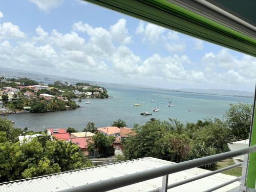 a view of a body of water with boats in it at akate in Les Trois-Îlets