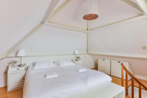 Giường trong phòng chung tại Mio appartementen