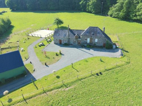 an aerial view of a house in a field at Chez Sam et Brice in Saint-Georges-Buttavent
