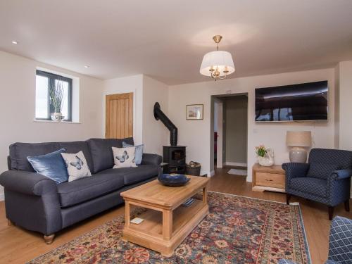 a living room with a couch and a coffee table at The Coach House - Ukc2772 in Sandwich
