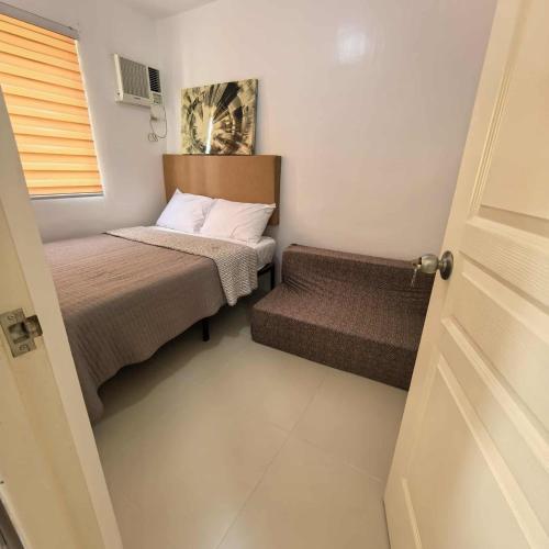 Postel nebo postele na pokoji v ubytování Davao City Airport Transient Rooms by Lemonique