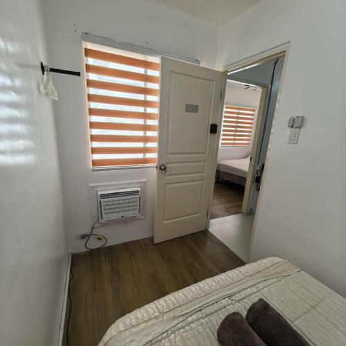 Postel nebo postele na pokoji v ubytování Davao City Airport Transient Rooms by Lemonique
