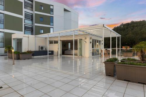 a building with awning in front of a building at Two-Story Penthouse Apartment in Gosford