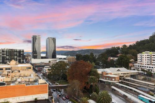 a city skyline with tall buildings and a street at Two-Story Penthouse Apartment in Gosford