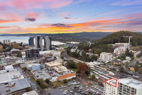 an aerial view of a city with buildings and cars at Two-Story Penthouse Apartment in Gosford