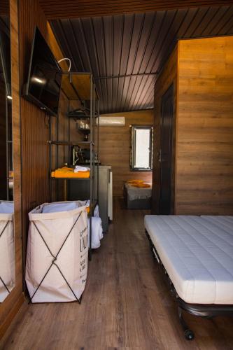a bedroom with a bed in a small room at Albatross Family Nest Breeze Bungalow in Varna City