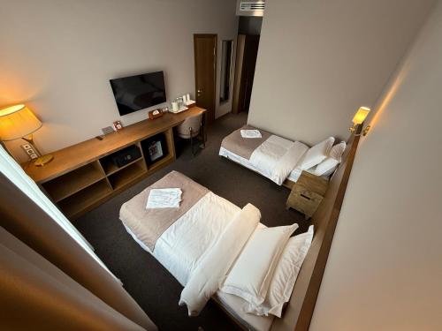 Katil atau katil-katil dalam bilik di Primavera Hotel