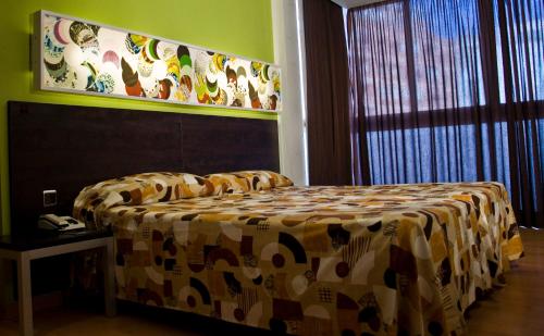 Un pat sau paturi într-o cameră la Sol y Sombra