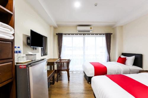 Una cama o camas en una habitación de Canary House Rachawong คานารี่ เฮ้าส์ ราชวงศ์