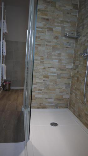 a shower with a glass door in a bathroom at Hotel Europa in Marostica