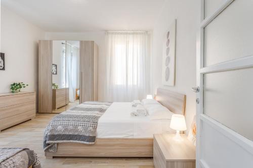 Postel nebo postele na pokoji v ubytování Appartamento vicino Ospedale con self check-in
