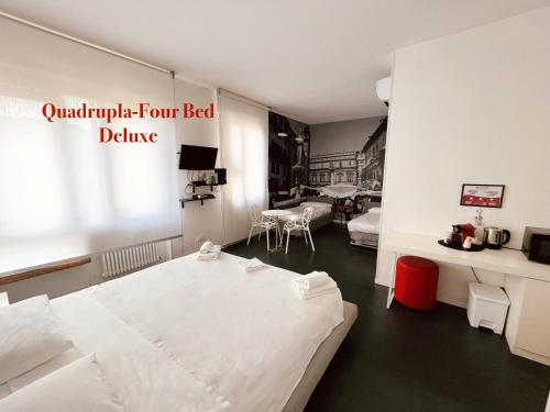 a hospital room with a bed and a table at DiMoras house Verona in Verona