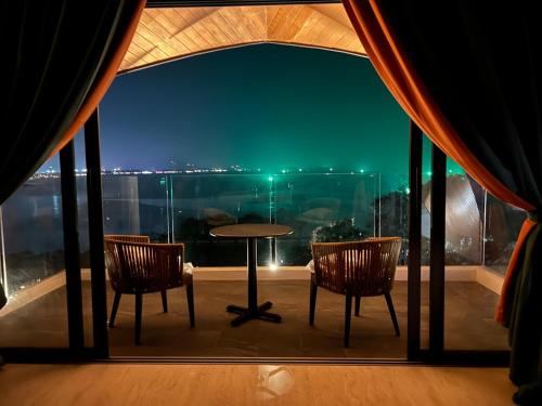 a room with a table and two chairs and a window at Golden Coconut 4 Bed 6 Bath Luxury Sea View Villa in Chaweng Beach, Koh Samui in Amphoe Koh Samui