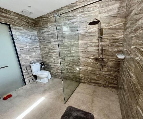 a bathroom with a glass shower with a toilet at Golden Coconut 4 Bed 6 Bath Luxury Sea View Villa in Chaweng Beach, Koh Samui in Amphoe Koh Samui