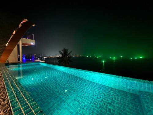 a swimming pool at night with a view at Golden Coconut 4 Bed 6 Bath Luxury Sea View Villa in Chaweng Beach, Koh Samui in Amphoe Koh Samui