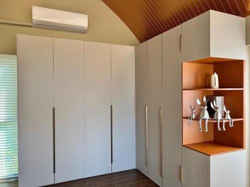 a room with white cabinets and a ceiling at Golden Coconut 4 Bed 6 Bath Luxury Sea View Villa in Chaweng Beach, Koh Samui in Amphoe Koh Samui