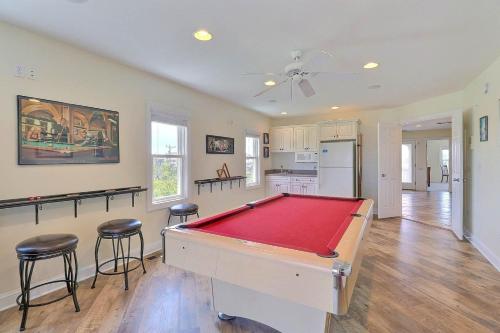 a room with a pool table and two bar stools at 7076 - JMJ Seascape in Nags Head
