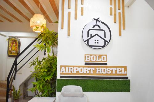 a sign for an airport hospital in a room at BOLO AIRPORT HOSTEL l in Mactan Cebu International
