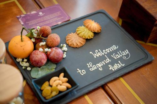 a birthday cake with fruits and vegetables on a table at Legend Valley Hotel Ha Nam in Phủ Lý