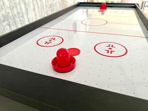 a ping pong table with a red heart on it at 12pax 3-Bedroom l Seaview l Georgetown l Gleneagles l Mansion One in George Town