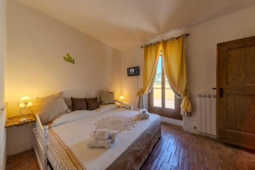 Katil atau katil-katil dalam bilik di Agriturismo Dai Du Bourdei