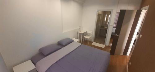 Postel nebo postele na pokoji v ubytování Vee Condo 502