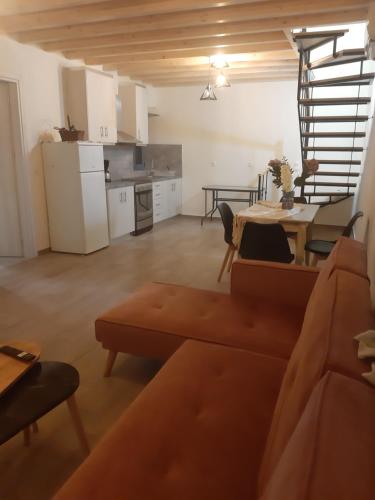 a living room with a couch and a table at Mary's home in Atsikí