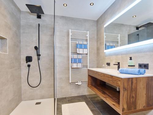 a bathroom with a shower and a sink at Haus Klaudia Gstrein in Längenfeld