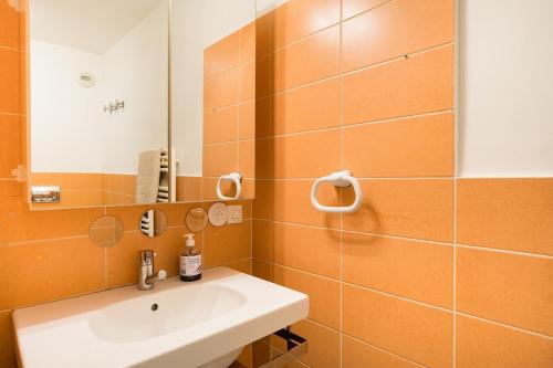 a bathroom with a sink and a mirror at Air conditioned apartment, 3 min walk to the beaches, Garage in Antibes