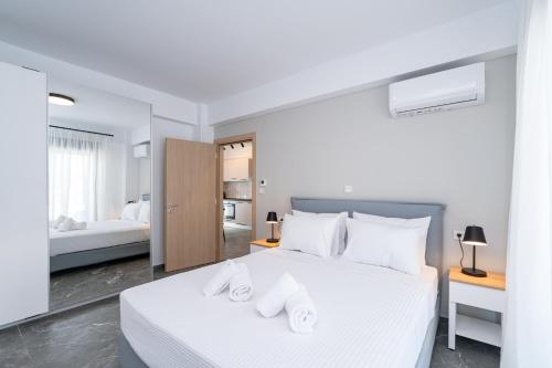 Postel nebo postele na pokoji v ubytování Olympiada Residential Complex & Villas