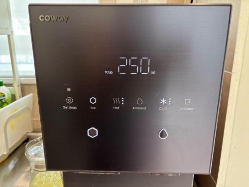 a close up of a microwave oven with its controls at Duyong Damai Homestay by KOWBMAS in Melaka