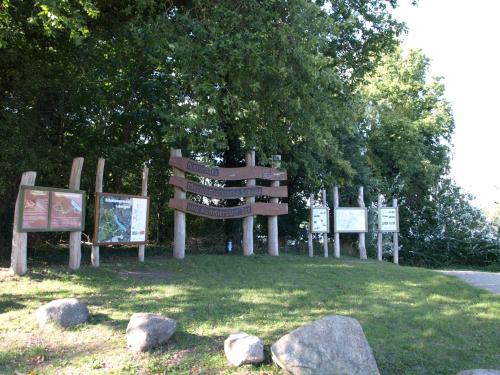 a group of signs sitting in the grass at Ferienhaus Geers am Klostersee Dargun in Dargun