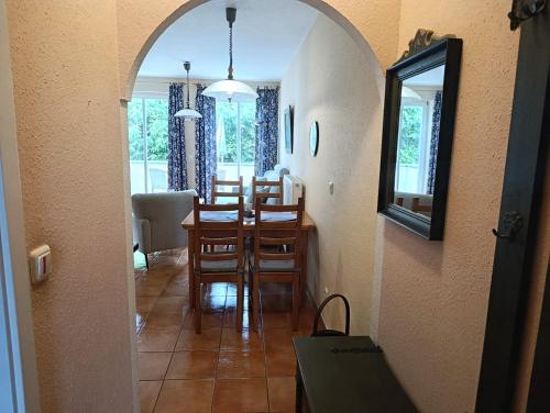 a dining room and kitchen with a table and chairs at Störtebeker 07 in Kühlungsborn