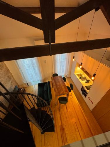 an overhead view of a living room with a table and chairs at Porto Suites in Porto