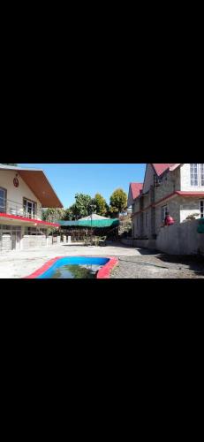 a picture of a swimming pool in a city at Newachhen homestay in Kalimpong