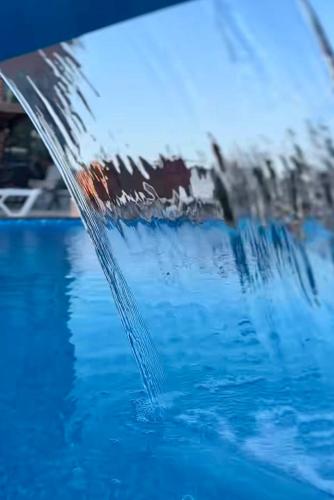 a close up of the side of a swimming pool at Laia Hotel House in Itʼkhvisi