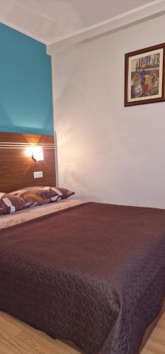a bedroom with a large bed in a room at Róża Wiatrów 2 Władysławowo in Władysławowo