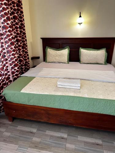 Karibu guest house sipiにあるベッド