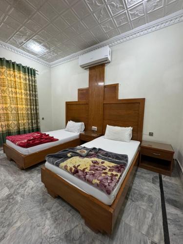 Кровать или кровати в номере Comfort Rezidor Guest House