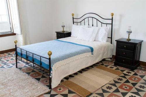 En eller flere senge i et værelse på Alojamento O Tordo