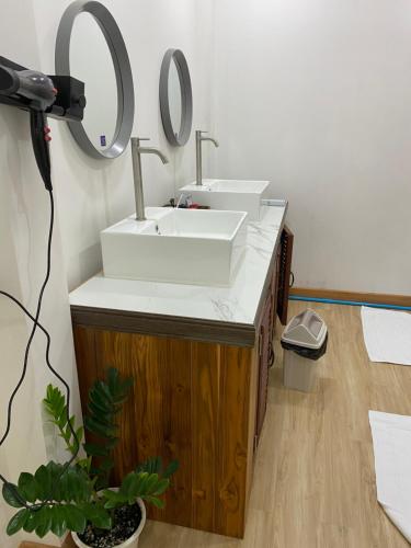 a bathroom with a sink and a mirror at Dream station hostel in Pakse