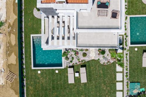 an aerial view of a house with a pool at Olympiada Residential Complex & Villas in Ofrínion