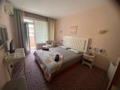 Postel nebo postele na pokoji v ubytování Art Guest House Orchidea
